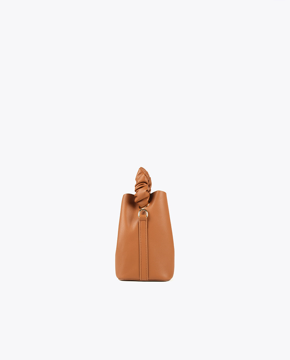 Crossbody bag with gathered strap