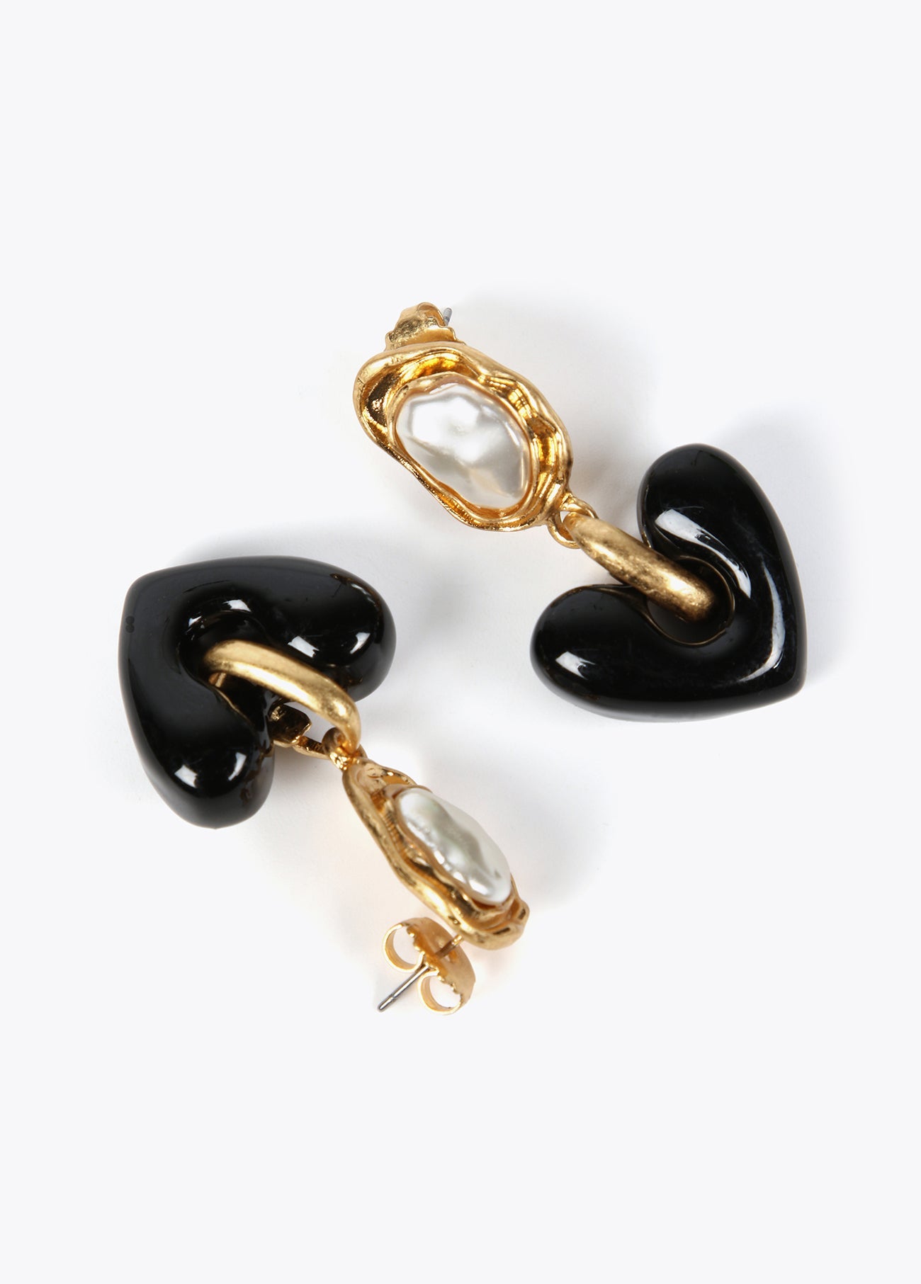 Gold-toned earrings with black heart