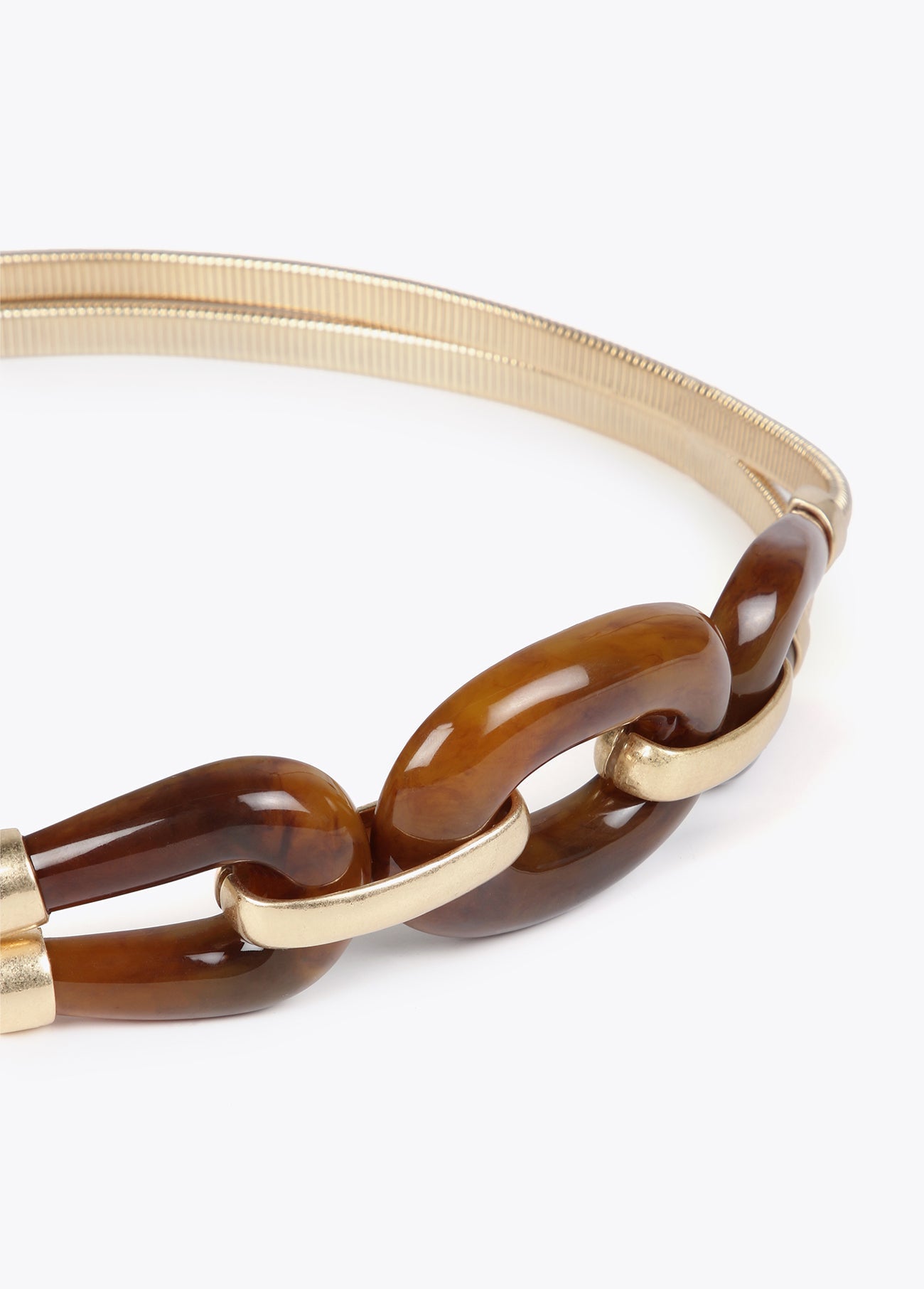 Stretch metal belt with tortoiseshell pieces