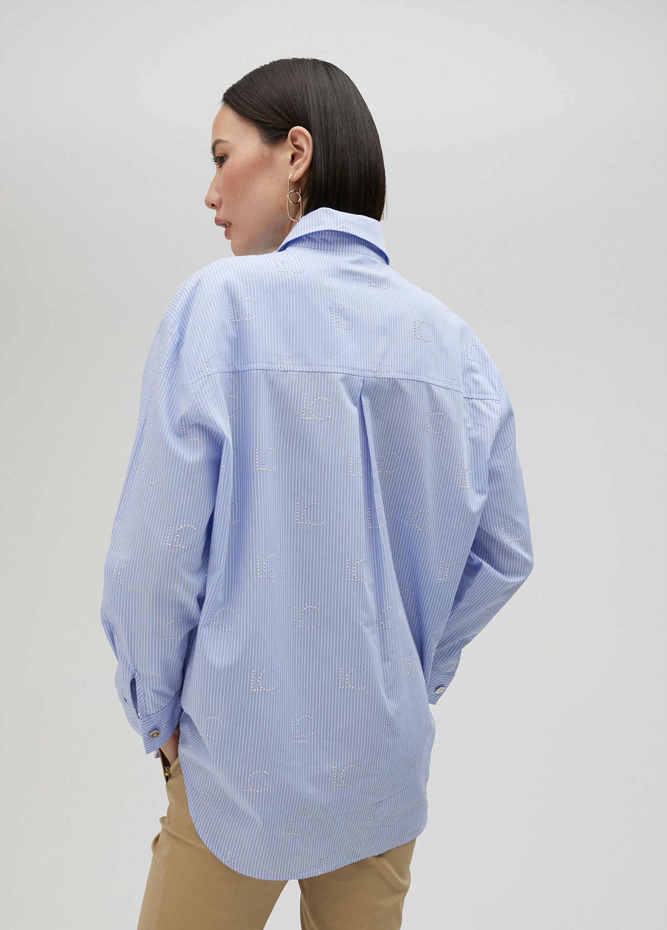 Striped shirt with rhinestone logo