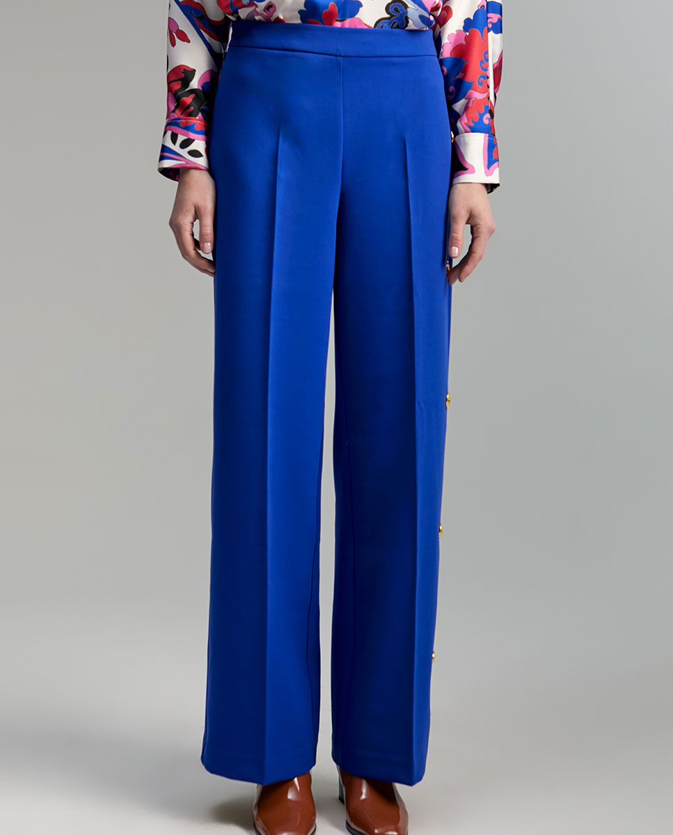 Trousers with snap buttons
