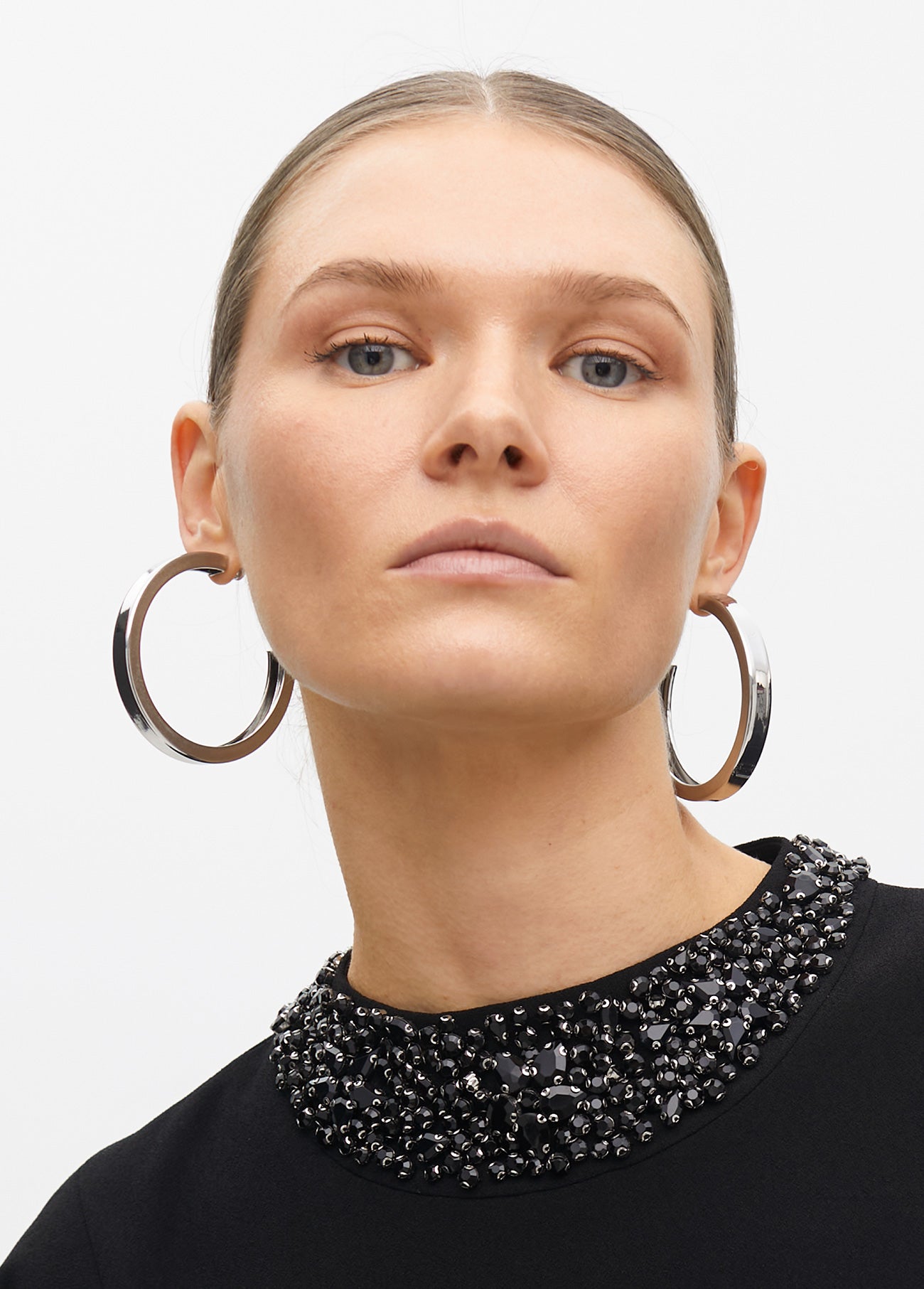 Dress with cape sleeves and a rhinestone collar