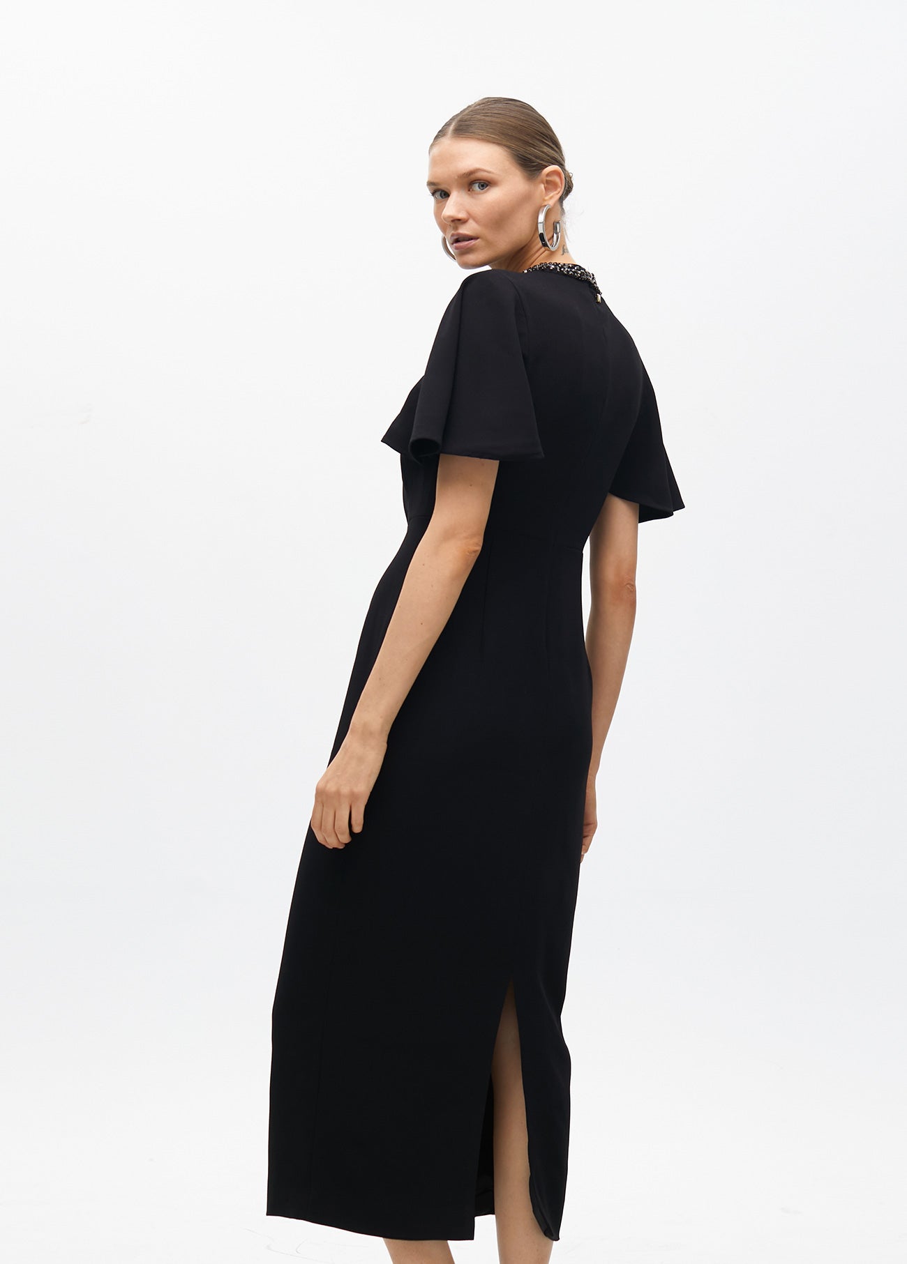 Dress with cape sleeves and a rhinestone collar