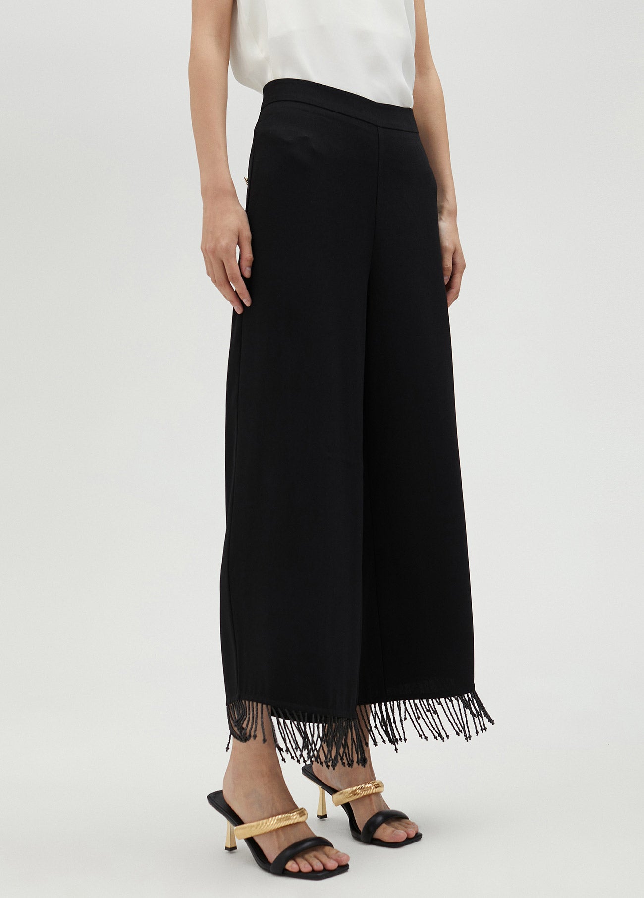 Trousers with fringing and rhinestones