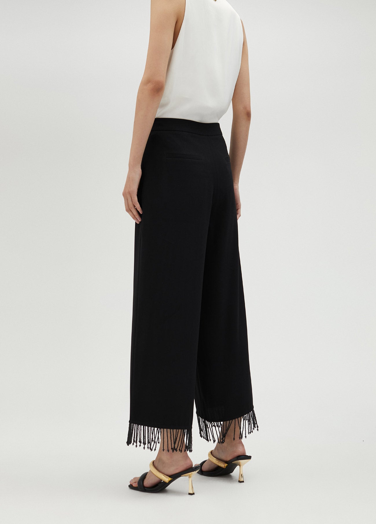 Trousers with fringing and rhinestones
