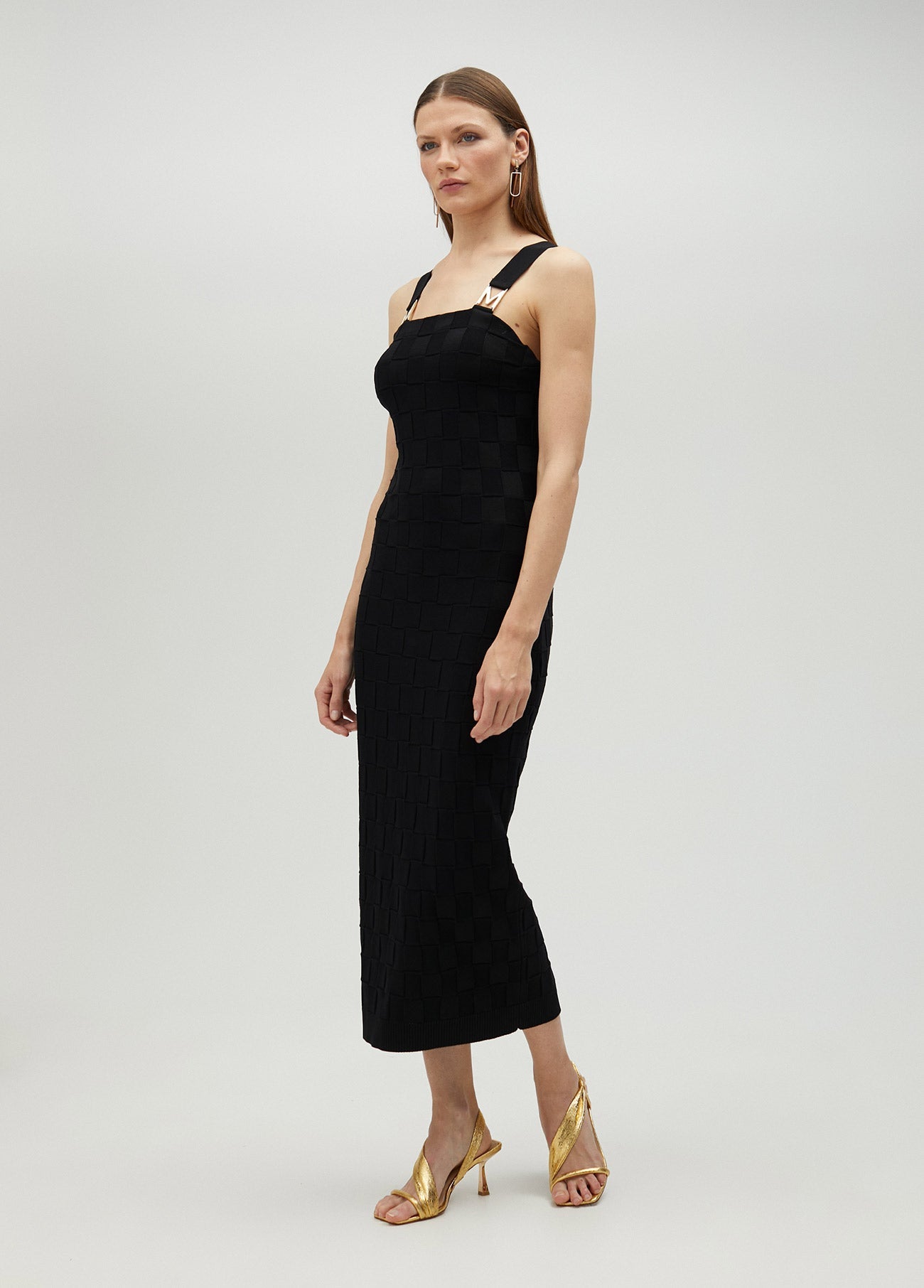 Knit dress with M detail on the strap